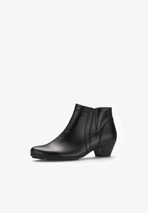 Schwarze Leder-Ankle-Boots mit abgerundeter Spitze, seitlichen elastischen Einsätzen, dezenten Nähdetails und einem niedrigen Blockabsatz.