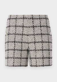 Tweed-shortsit neutraalivärviga, must-valge ruudulisandiga. Ees on dekoratiivsed nupud. Tekstuuriga kangas.