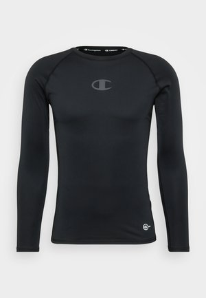 Czarna, długo rękawowa koszulka sportowa o dopasowanym kroju, z małym szarym logo na klatce piersiowej i okrągłym dekoltem. Gładka faktura.