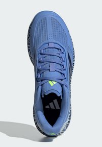 Blue athletic shoe with mesh panels, textured surfaces, and a multicolored sole; features laces and a logo on the tongue and insole.