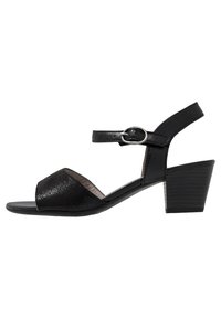 Svarta klackade sandaler med en strukturerad glittrande ovandel, öppen tå, ankelrem med metallspänne och en staplad blockklack.