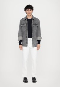 Michael Kors FINN - Straight leg jeans - white