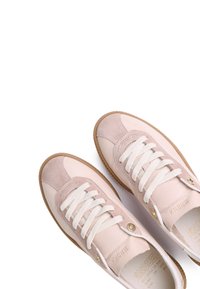 Light pink sneakers featuring suede and leather materials, round toe, and white laces. Includes gold eyelets and rubber sole.