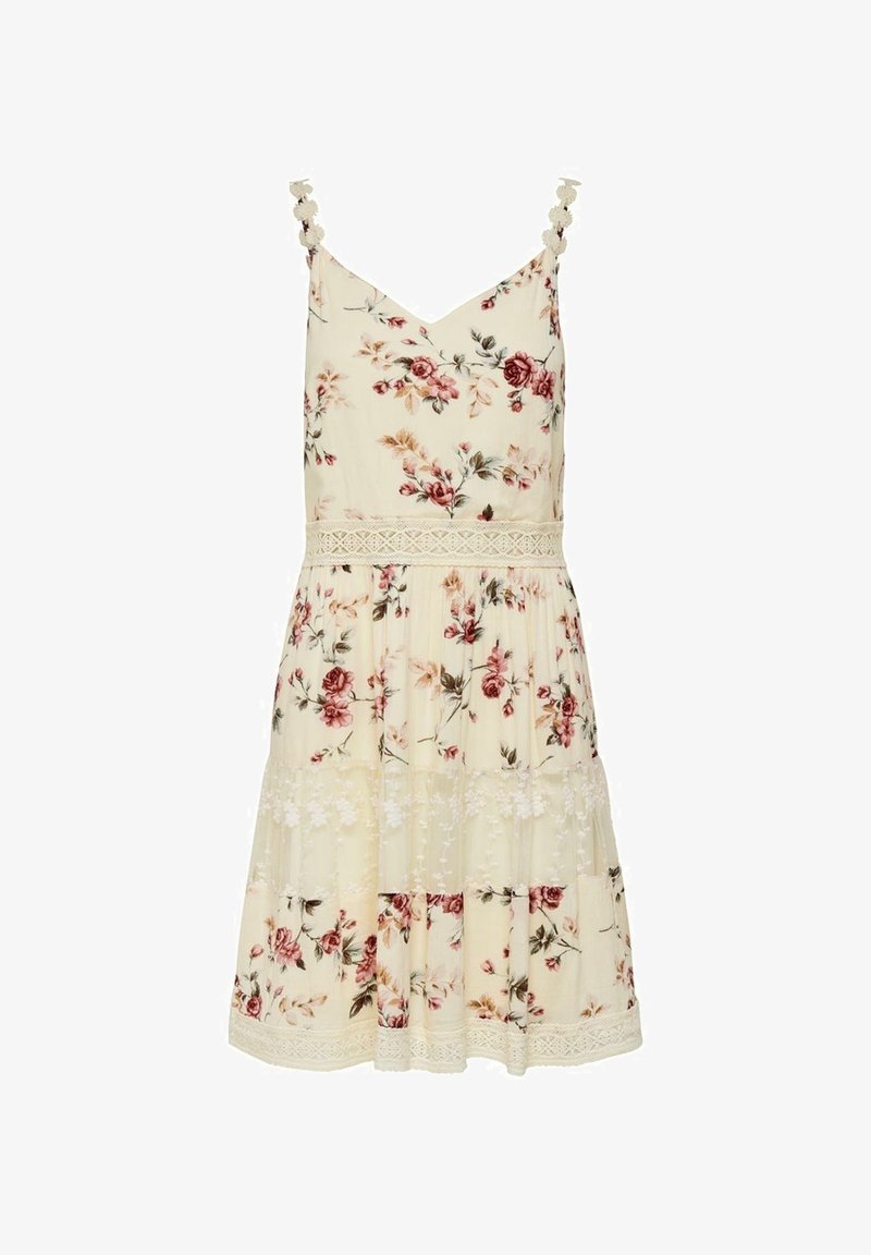 Květinové šaty z krémové tkaniny s tenkými ramínky, krajkovým lemem a patrovými volány. Malé květinové vzory v odstínech růžové a zelené.