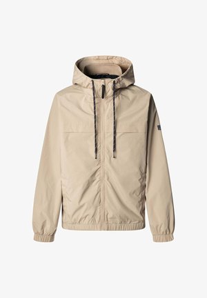 Beežist kerge jope kapuutsiga, elastsete varrukaotste ja nööriga. Omadusteks kaks rinnataskut ja sile, vee eest kaitsev kangas.