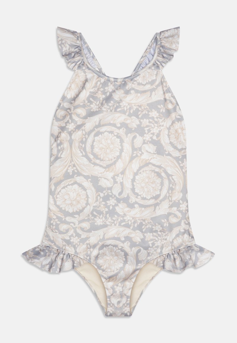 Enodelni kopalke z cvetličnim vzorcem v svetlo sivi in kremni barvi, z rahlo nabranimi naramnicami in obrobo. Mehka, raztegljiva tkanina. Srednje izrezana odprtina za noge.