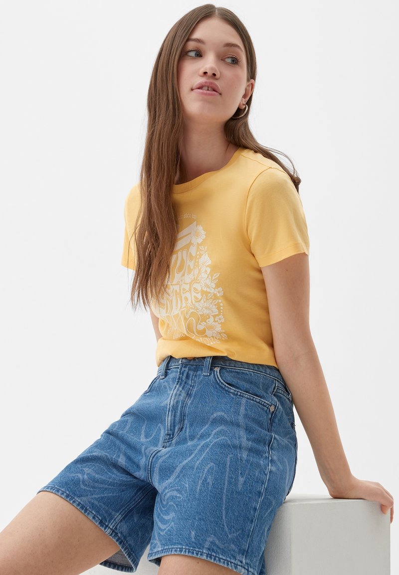 OBEY - T-shirt bleu avec sérigraphie dans le dos