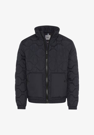 Giacca a vento nera con colletto alto, caratterizzata da un motivo trapuntato, due grandi tasche frontali e chiusura con zip frontale.