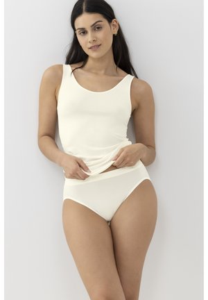 Light cream tank top and matching briefs, both in a smooth, stretchy fabric. Top features a scoop neck; briefs have a simple, clean design.