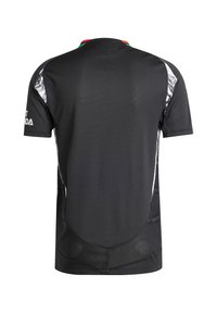T-shirt de sport noir à manches courtes, présentant des motifs intriqués en blanc et vert sur les épaules et une texture subtile sur l'ensemble.