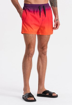 Costume da bagno in una gradazione dall'arancione al viola, realizzato in tessuto ad asciugatura rapida. Caratterizzato da una vita elasticizzata e tasche laterali.