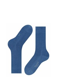 Niebieskie bawełniane skarpetki o gładkiej fakturze, z żeberkowanymi mankietami w kostce i logo na podeszwie. Prosty design bez wzorów czy akcentów.