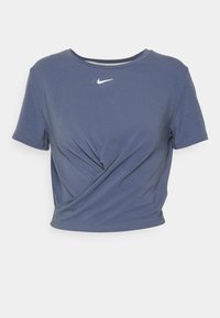 Short-sleeve, cropped t-shirt in navy blue, featuring a twisted design at the front and a white Nike logo on the chest. Soft, jersey fabric.