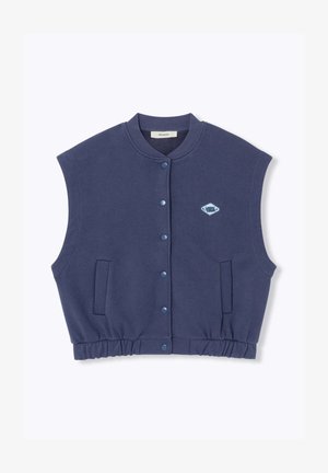 Gilet sans manches bleu marine fabriqué en matériau doux, avec une fermeture à boutons, une taille élastique et deux poches latérales. Petit logo sur la poitrine.