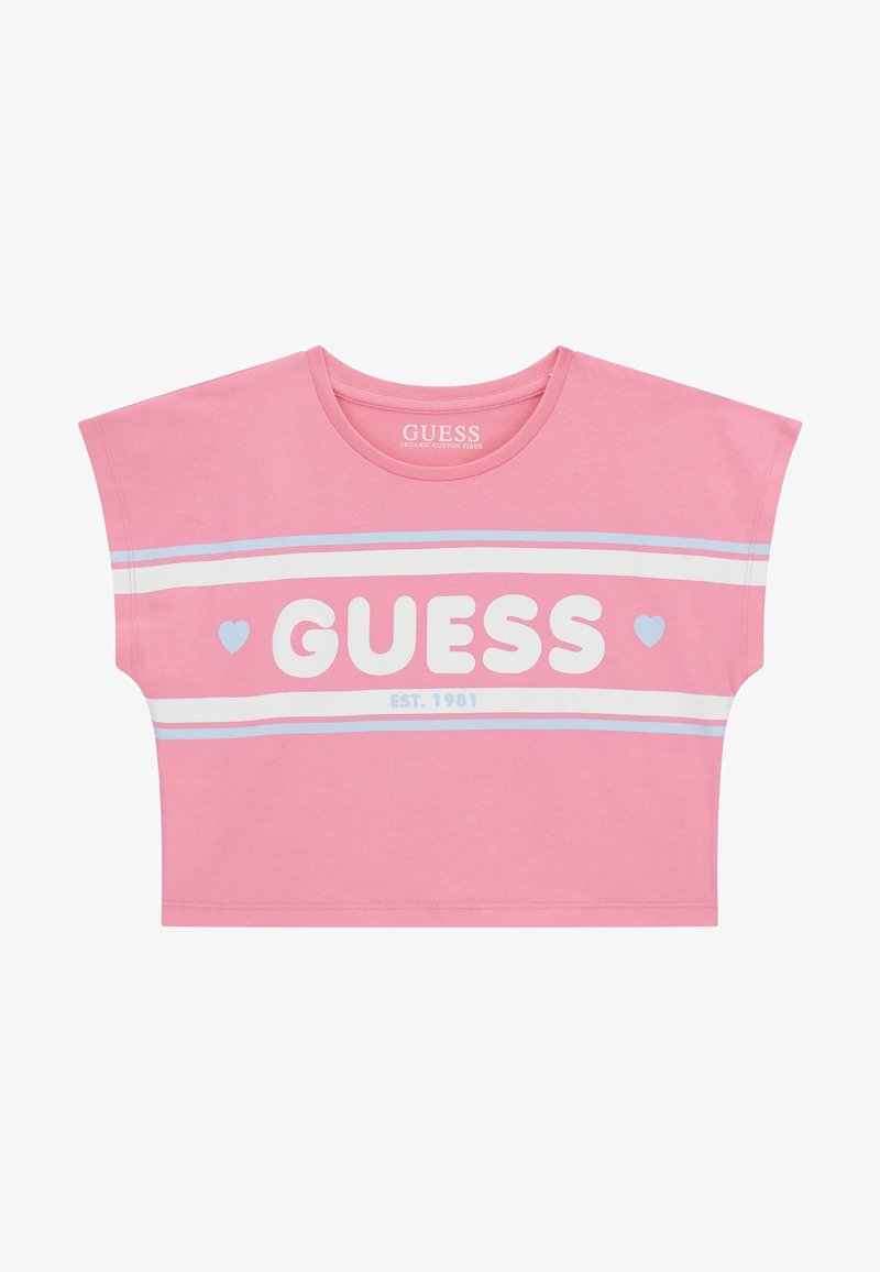 Roosa lühike t-särk, mis on valmistatud orgaanilisest puuvillast. Särgil on valge "GUESS" logo, sinised ja valged triibud ning väike südame detail.