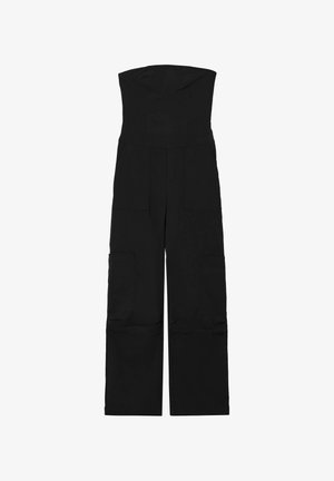 Combinaison noire sans bretelles avec un corsage ajusté et un style à jambes larges. Dispose de plusieurs grandes poches de chaque côté et d'un tissu lisse et durable.