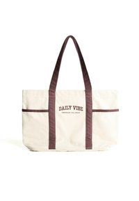Canvas-Shopper mit dunkelbraunen Trägern und dem Text "DAILY VIBE EMBRACE BALANCE" auf einem hellbeigen Hintergrund.