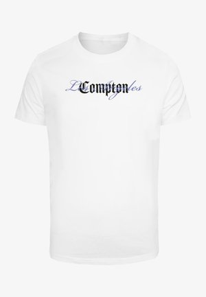 White cotton t-shirt featuring black and blue stylized text "L Compton" in graphic font across the chest. Standard crew neck design.