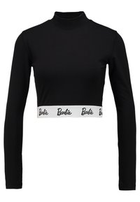 Svart långärmad croptop i elastiskt material, med hög hals och ett vitt band med "Barbie"-logotyp. Slät textur.
