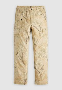 Beige cargo-housut, joissa on luontoon inspiroituva kuosi oksista ja lehdistä. Ominaisuuksiin kuuluu sivutaskut ja nappikiinnitys vyötäröllä.