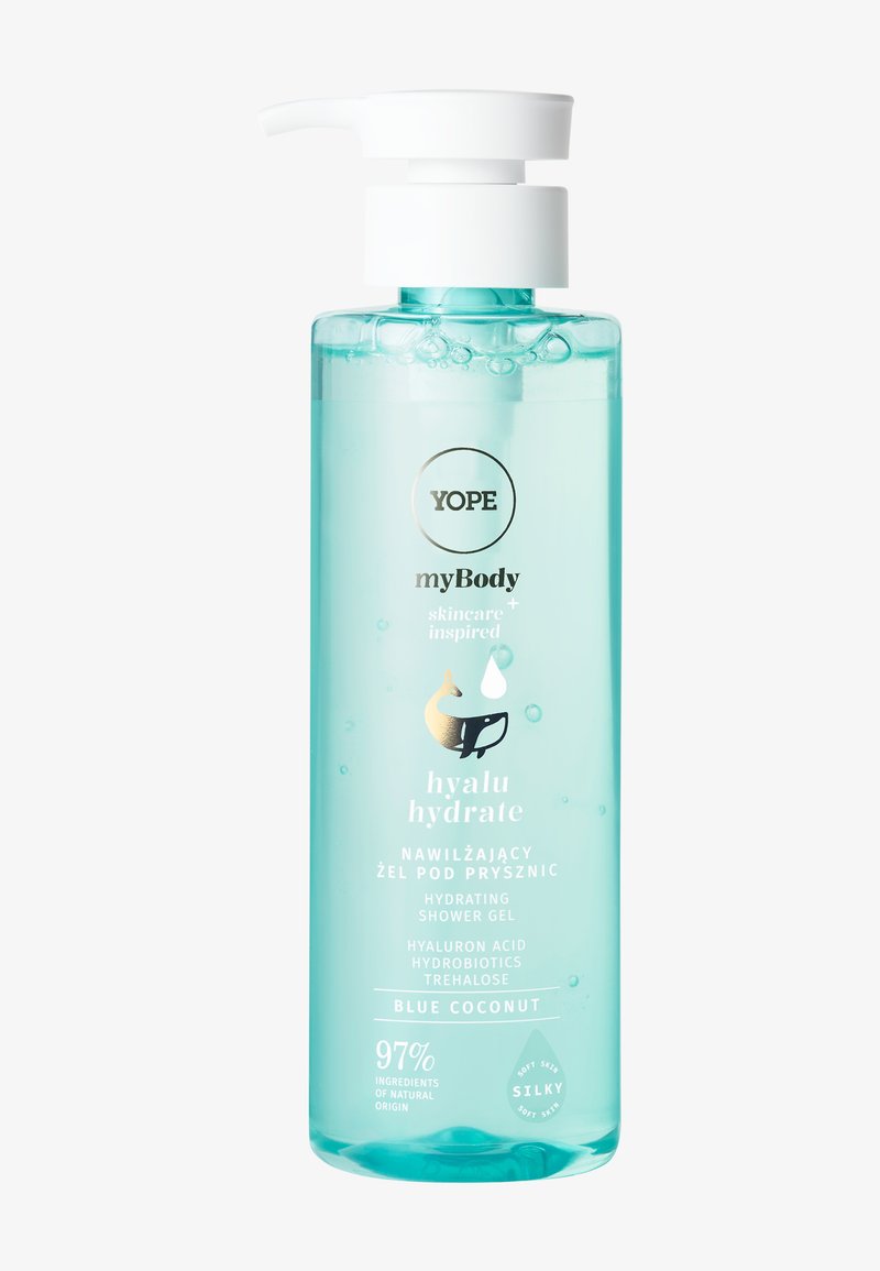 Groen plastic flesje met een witte pomp bovenop. Het etiket bevat zwarte en gouden tekst met aquatische afbeeldingen. Inhoud is doorschijnende blauwe gel.