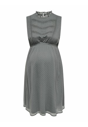 Abito premaman in morbido tessuto grigio testurizzato, con collo alto, design senza maniche e un sottile motivo a pois. Presenta una vita arricciata.