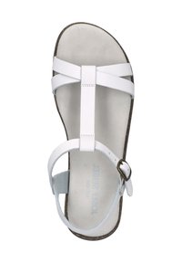 White leather sandal with a flat sole, featuring cross straps and an ankle strap with a metal buckle. Textured footbed and smooth finish.