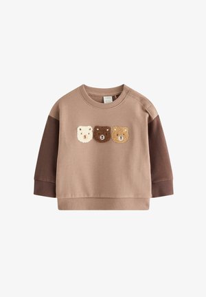 Beiger Langarm-Sweatshirt für Kleinkinder mit dunkleren braunen Ärmeln und drei strukturierten Teddy-Gesichtern in Creme, Dunkelbraun und Hellbraun auf der Vorderseite.