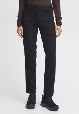 Schwarze, eng anliegende Hosen mit glatter Textur, hohem Bund, zwei vorderen Reißverschlusstaschen und schmal zulaufendem Bein.