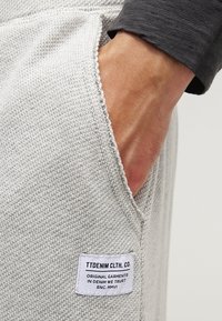 TOM TAILOR DENIM Pantalon de survêtement - mottled grey