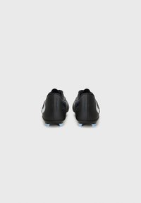 Black soccer cleats with a smooth finish, featuring a blue outsole and white lateral logo. Design includes a low silhouette and padded collar.