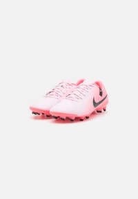 Pink soccer cleats with a smooth synthetic upper, black accents, and a low profile design. Firm ground studs for traction.