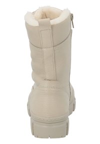 Botín de cuero beige hasta el tobillo con un acabado texturizado, forro interior suave y cremallera trasera. Cuenta con una suela resistente con relieve.