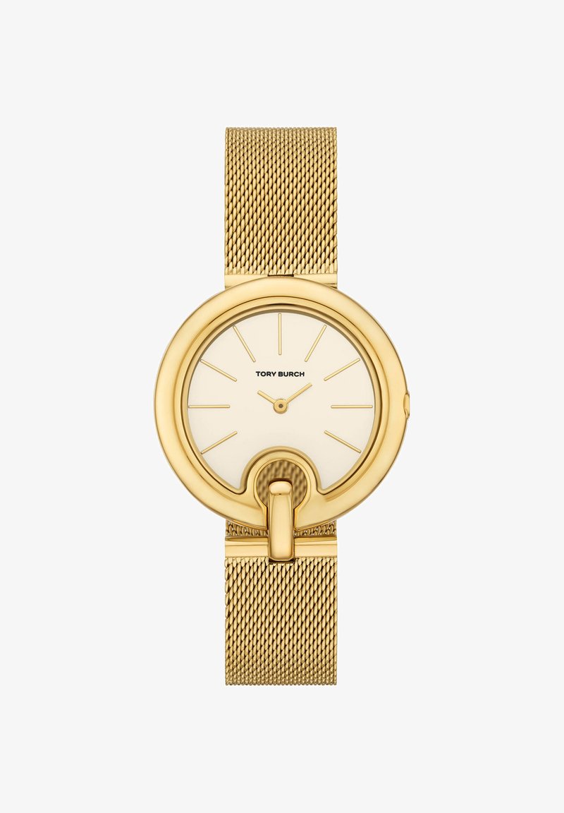 Goldfarbene Tory Burch Armbanduhr mit Mesh-Armband, minimalistischem Zifferblatt ohne Zahlen, goldenen Markierungen und einer Schlaufe am unteren Rand des runden Zifferblatts.