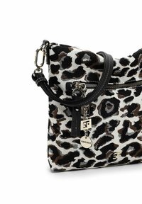 Leopard print bag made of textured fabric, featuring a silver zipper, black accents, and a decorative charm. Compact and stylish design.
