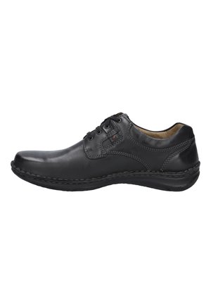 Chaussure décontractée pour hommes en cuir noir avec lacets, col rembourré et coutures détaillées, vue de côté sur fond blanc.