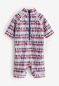 Rash guard à manches courtes en tissu extensible, avec un fond bleu et des motifs de soldats en cartoon répétitifs en rouge et noir. Fermeture éclair.