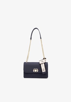 Navy leather handbag with a flap closure, gold-tone hardware, and a chain strap. Features a decorative strap with branding.