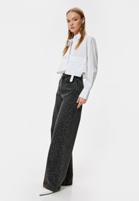 Koton WIDE LEG - Leveälahkeiset - black