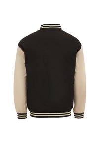 Giacca nera con maniche beige, colletto e polsini a costine con strisce crema. Tessuto liscio, design sportivo, vista posteriore mostrata.