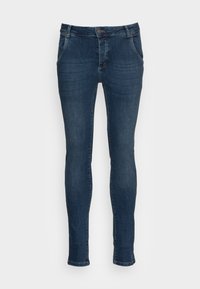 Dark blue skinny jeans made of denim, featuring a classic 5-pocket design, zipper fly, and slight faded texture on the legs.