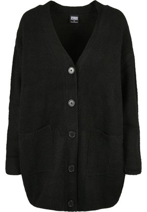 Zwarte oversized cardigan van textuurgebreide stof, met een V-hals, knopen aan de voorkant en twee grote zakken.