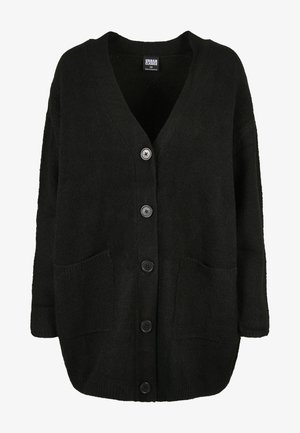 Cardigan oversized nero realizzato in tessuto a maglia testurizzato, con scollo a V, bottoni frontali e due grandi tasche.