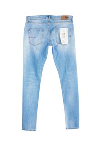Jeans skinny azzurri realizzati in denim, con una finitura sbiadita, due tasche posteriori e una etichetta in pelle con il marchio sul cinturino.