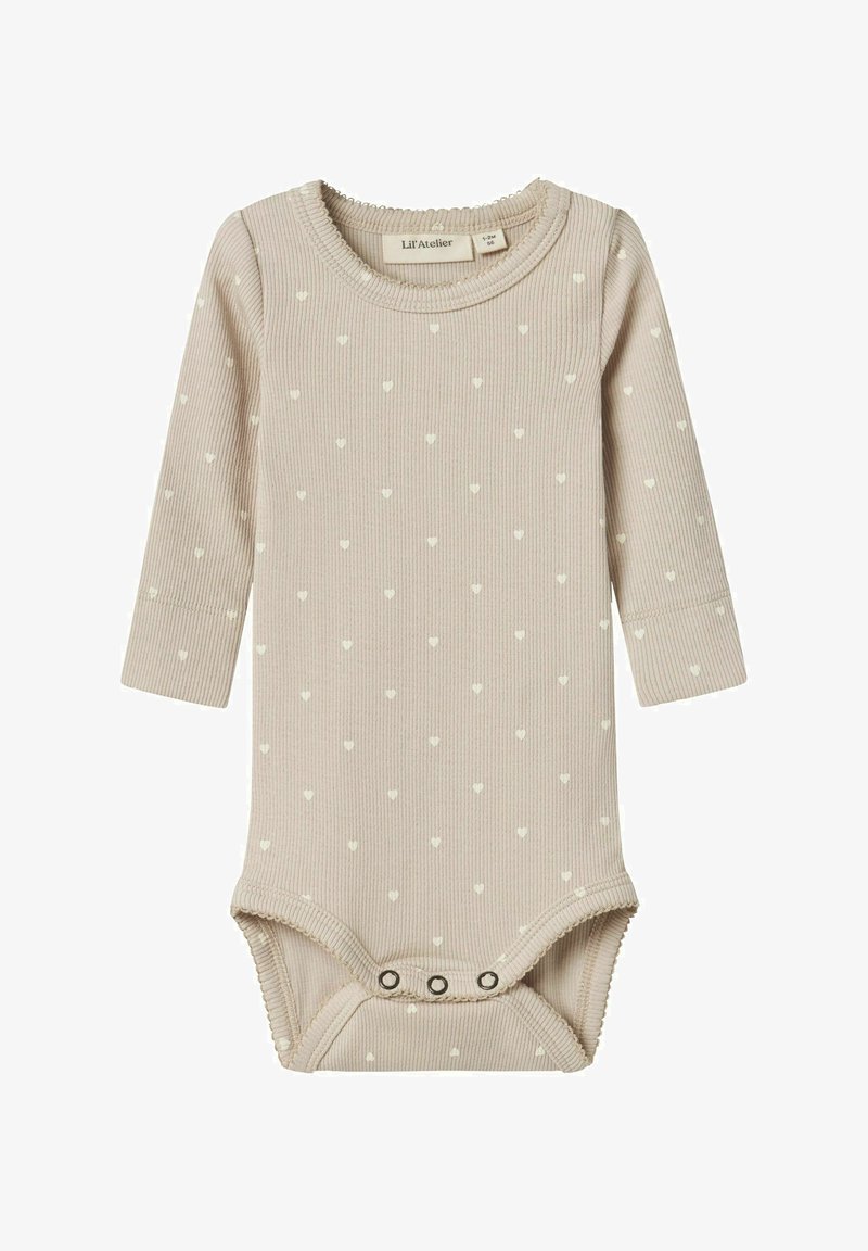 Bežinis raibuotas ilgomis rankovėmis bodžiukas su mažais baltais širdelių raštais. Turi apvalų iškirpimą ir snapeliais užsegamus apačioje, kad lengviau būtų apsirengti.