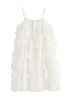 Hvid ærmeløs kjole med lag, tynde stropper og lagdelt flæset stof fra top til kant.