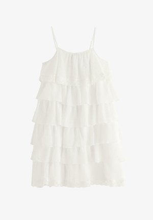 Hvid ærmeløs kjole med lag, tynde stropper og lagdelt flæset stof fra top til kant.