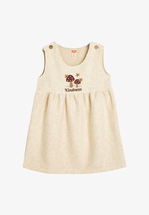 Beige bomulds kjole med en svajet nederdel, prydet med broderi af svampe og blomster samt ordet "Venlighed." Inkluderer to skulderknapper.