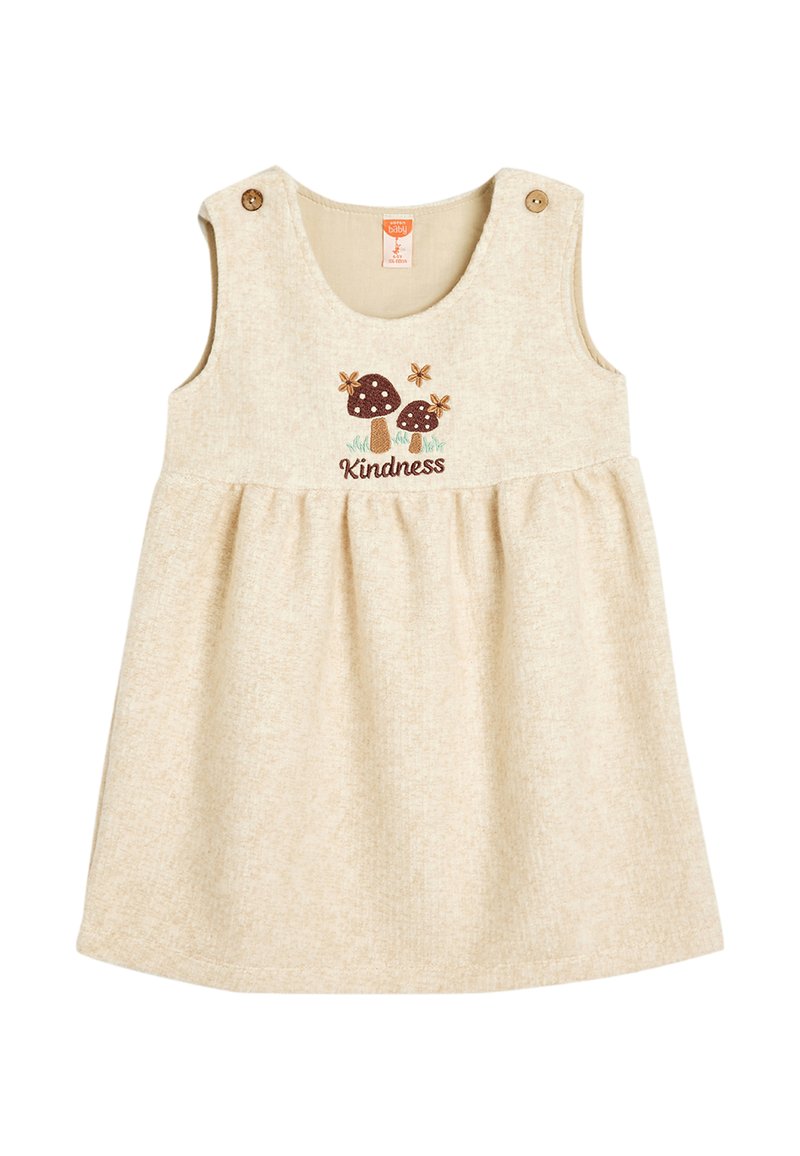 Beige bomulds kjole med en svajet nederdel, prydet med broderi af svampe og blomster samt ordet "Venlighed." Inkluderer to skulderknapper.