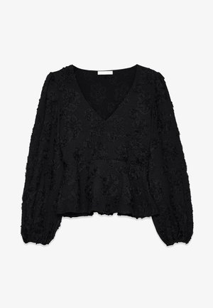 Black peplum top with a V-neck, featuring textured floral patterns, long puff sleeves, and elasticized cuffs. Soft, textured fabric.